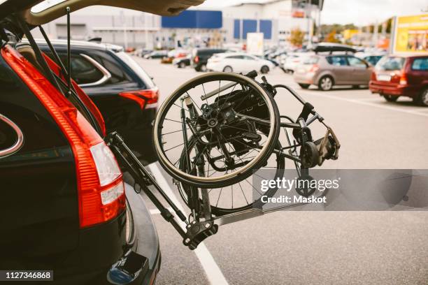 wheelchair in car trunk at parking lot - wheelchair accessibility stock pictures, royalty-free photos & images