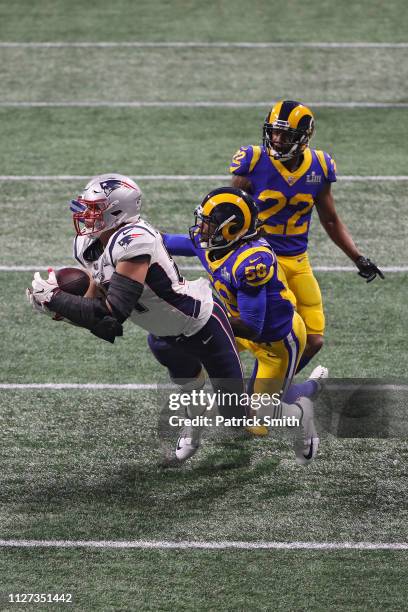 Rob Gronkowski of the New England Patriots catches a 29-yard reception in the fourth quarter against the Los Angeles Rams during Super Bowl LIII at...