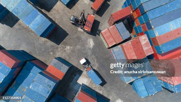 aerial top view crane truck drive lifting container in warehouse. - truck side view stock pictures, royalty-free photos & images