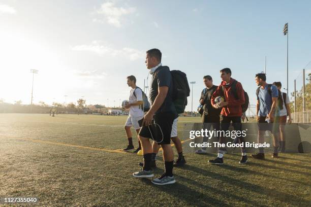 soccer players walking off soccer field - local soccer field stock pictures, royalty-free photos & images