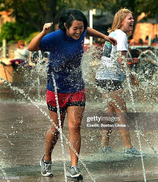 Tiffany Rhee and her friend Kristina Higgins both from Boston made a pact that they would run into the spray of the fountain at the Christian Science...