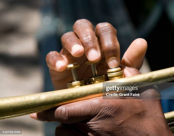 trumpet player's fingers - musical instrument close up stock pictures, royalty-free photos & images