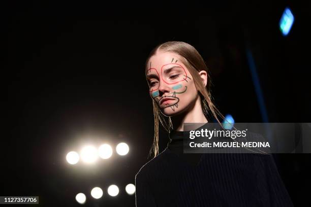 Model presents a creation by Alexandra Moura during the women's Fall/Winter 2019/2020 collection fashion show, on February 25, 2019 in Milan.
