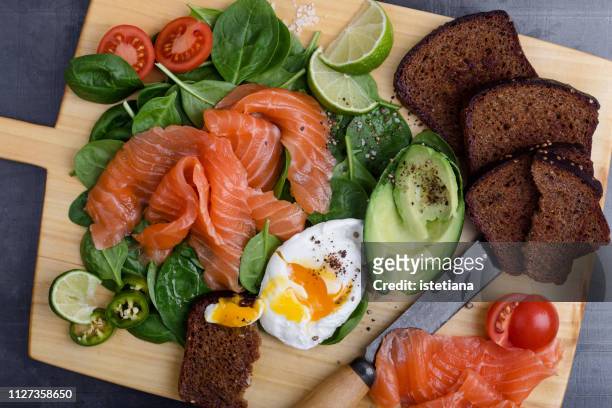 making delicious salad with  salted salmon and fresh vegetables - scandinavian culture stock pictures, royalty-free photos & images