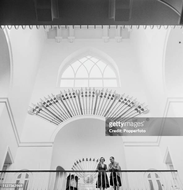 Ian Campbell, 11th Duke of Argyll and Margaret Campbell, Duchess of Argyll pictured together standing above the main hall in the galleried inner...