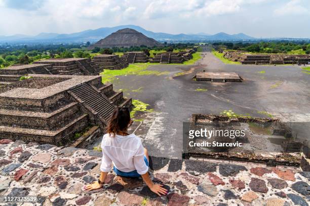 young woman visits teotihuacán pyramids in mexico - mexico city tourist stock pictures, royalty-free photos & images