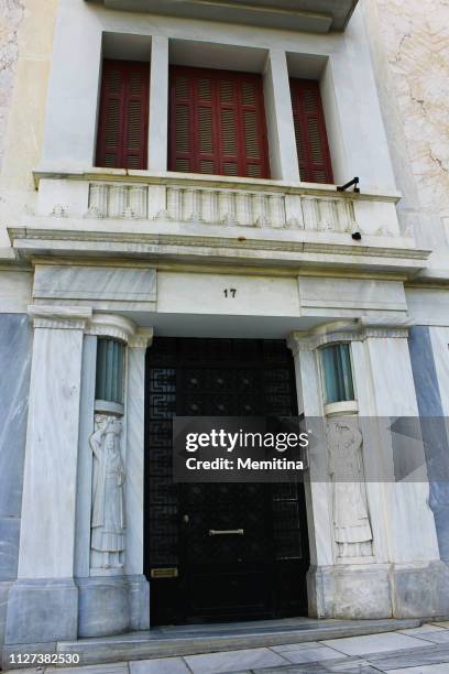 entrance of early 20th century polykatoikia in athens - imóvel tombado imagens e fotografias de stock