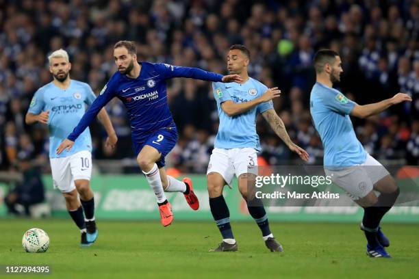 Gonzalo Higuain of Chelsea in action with Sergio Aguero; Danilo and Ilkay Gundogan of Manchester City during the Carabao Cup Final between Chelsea...