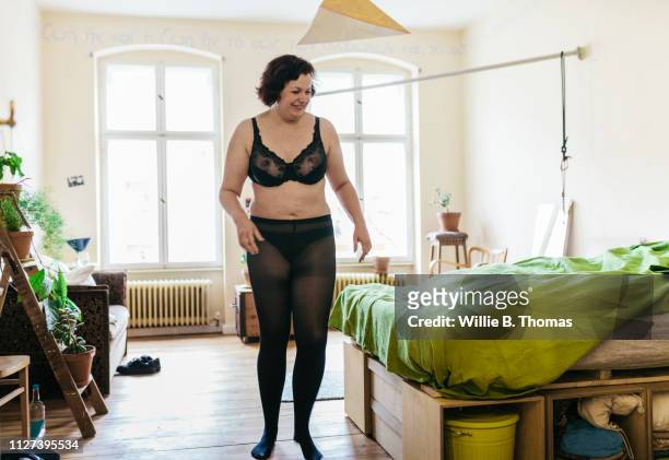 curvy women wearing underwear getting ready - stokes stock pictures, royalty-free photos & images