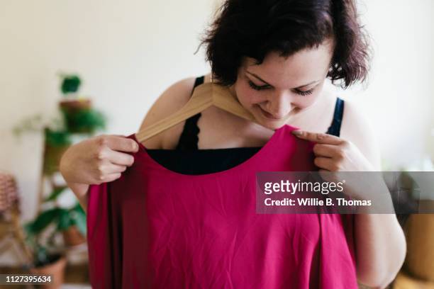 woman choosing what to wear - choosing outfit stock pictures, royalty-free photos & images