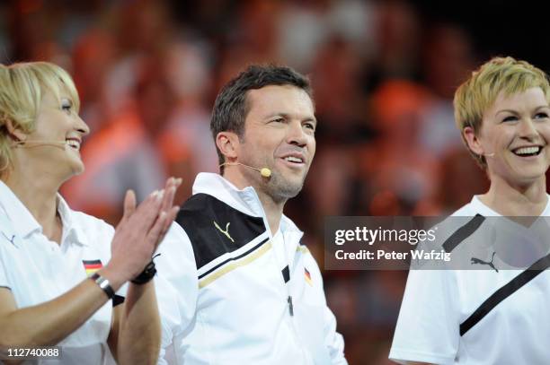 Ulla Kock am Brink, Lothar Matthaeus and Karen Heinrichs of team Germany laugh during the 'Deutschland Gegen Italien' TV Show on April 20, 2011 in...