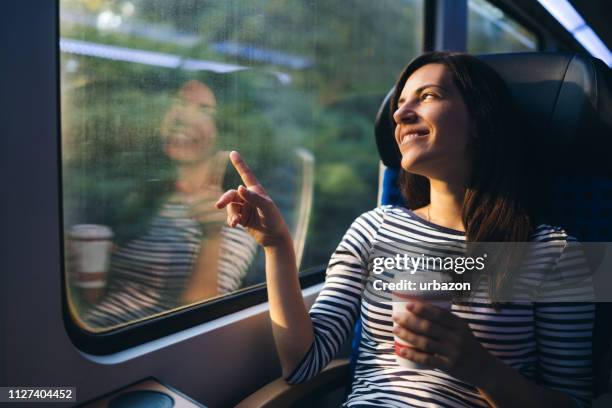 looking through window on a train ride - bus window stock pictures, royalty-free photos & images