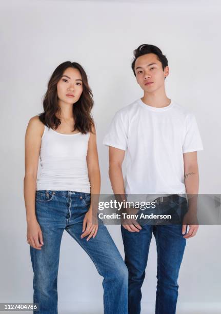 portrait of young adult brother and sister - white shirt stock-fotos und bilder