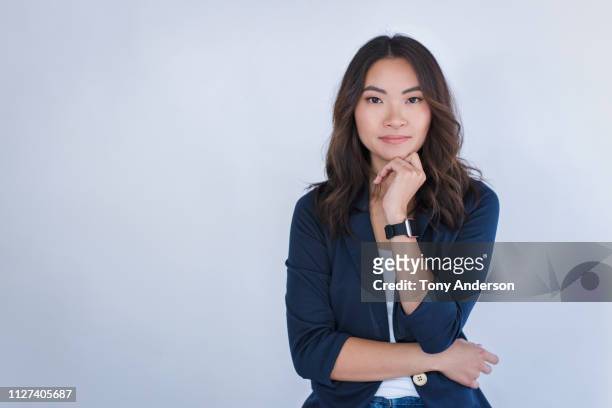 portrait of a young woman - blue blazer stock pictures, royalty-free photos & images