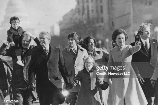 Jimmy, Amy and Rosalynn Carter walk in the inaugural parade in Washington, D.C. On January 20, 1977.