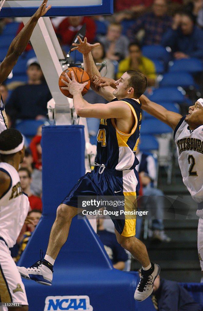 Trevor Huffman of the Kent State Golden Flashes goes to the basket ...