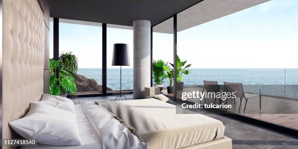 modern luxurious bedroom with large terrace in a villa by the ocean - panoramic room stock pictures, royalty-free photos & images