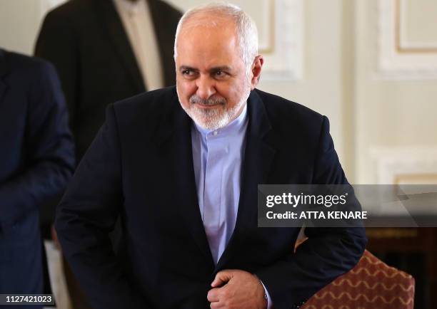 This picture taken on February 13, 2019 shows Iran's Foreign Minister Mohammad Javad Zarif gesturing during a press conference in Tehran. - Zarif,...