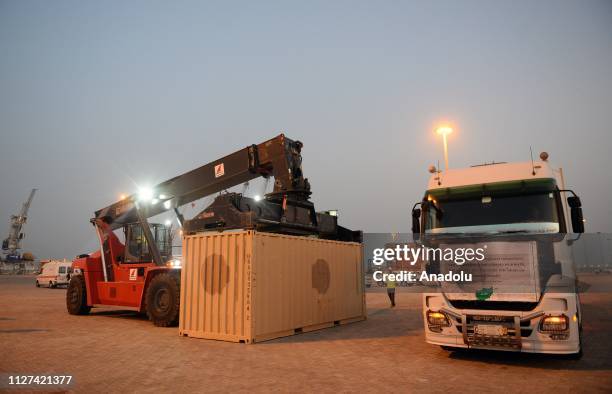 Container is being carried to the cargo vessel at Chabahar seaport during an inauguration ceremony for the first export convoy to India via Iran in...