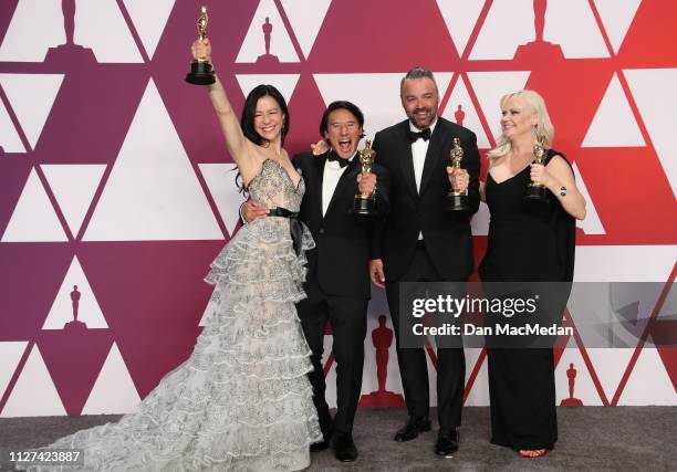 The producers of 'Free Solo', Elizabeth Chai Vasarhelyi, Jimmy Chin, Evan Hayes and Shannon Dill pose with the award for Best Documentary Feature in...