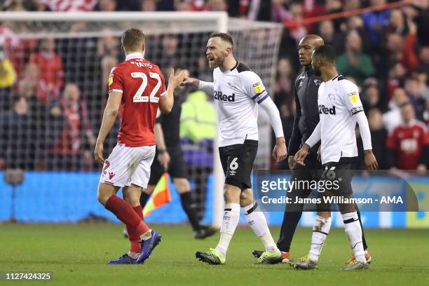 Ryan Yates of Nottingham Forest is confronted by Richard Keogh of Derby County at full time of the Sky Bet Championship match between Nottingham...