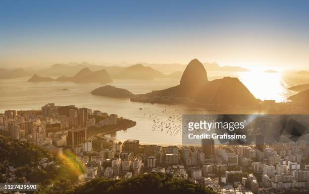 brazil rio de janeiro sugar loaf with guanabara bay at sunrise - rio de janeiro stock pictures, royalty-free photos & images