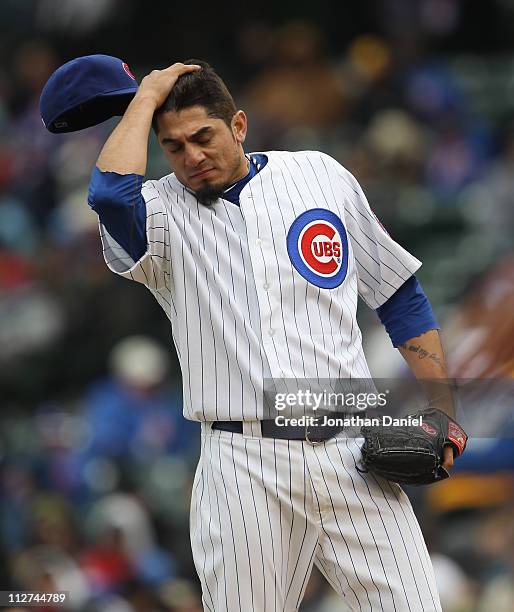 Starting pitcher Matt Garza of the Chicago Cubs reacts after walking the bases loaded in the 6th inning against the San Diego Padres at Wrigley Field...