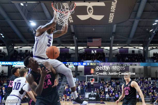 Dererk Pardon of the Northwestern Wildcats dunks the ball over Mike Watkins of the Penn State Nittany Lions during the second half at Welsh-Ryan...