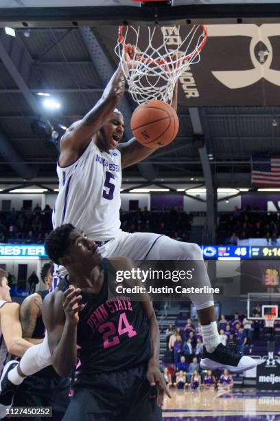 Dererk Pardon of the Northwestern Wildcats dunks the ball over Mike Watkins of the Penn State Nittany Lions during the second half at Welsh-Ryan...