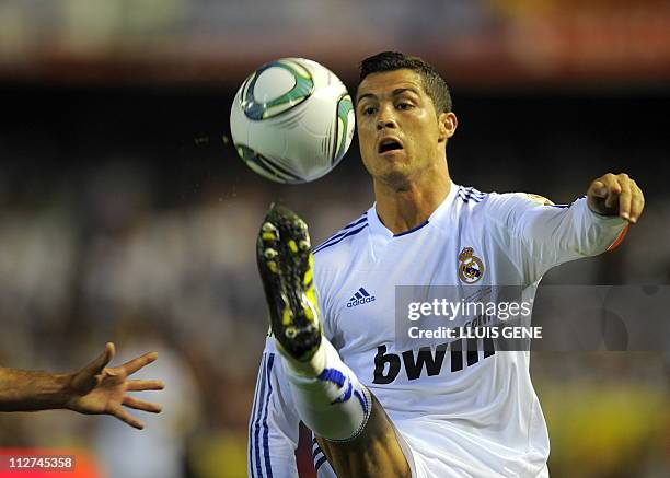 Real Madrid's Portuguese forward Cristiano Ronaldo controls a ball during the Spanish Cup final match Real Madrid against Barcelona at the Mestalla...