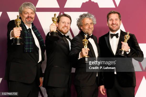 Best Visual Effects winners for 'First Man' Ian Hunter , Paul Lambert , Tristan Myles and J.D. Schwalm pose in the press room at the 91st Annual...