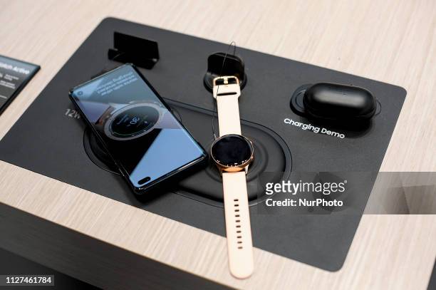 Demo exhibited of Samsung Wireless Charger Duo Pad, charging a Samsung Galaxy S10+, Samsung Galaxy Watch Active and Samsung Galaxy Buds, during the...