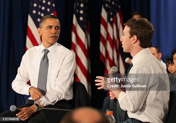 President Barack Obama talks with Facebook CEO Mark Zuckerberg during a town hall style meeting at Facebook headquarters on April 20, 2011 in Palo...