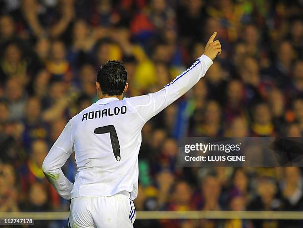 Real Madrid's Portuguese forward Cristiano Ronaldo celebrates after scoring during the Spanish Cup final match Real Madrid against Barcelona at the...