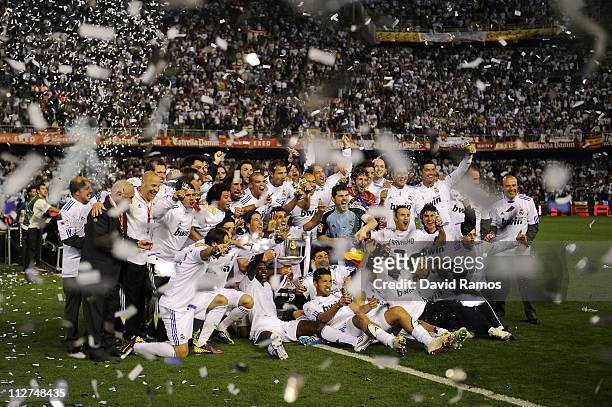 Real Madrid players celebrate with the Copa del Rey trophy after defeating Barcelona at the Copa del Rey Final between Real Madrid and Barcelona at...