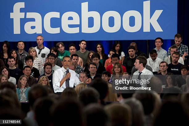 President Barack Obama, left, speaks while Mark Zuckerberg, co-founder and chief executive officer of Facebook Inc., listens during a town hall event...