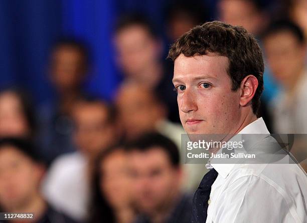 Facebook CEO Mark Zuckerberg looks on during a town hall style meeting with U.S. President Barack Obama at Facebook headquarters on April 20, 2011 in...