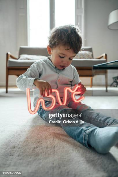 boy posing with heart - valentine's day home stock pictures, royalty-free photos & images