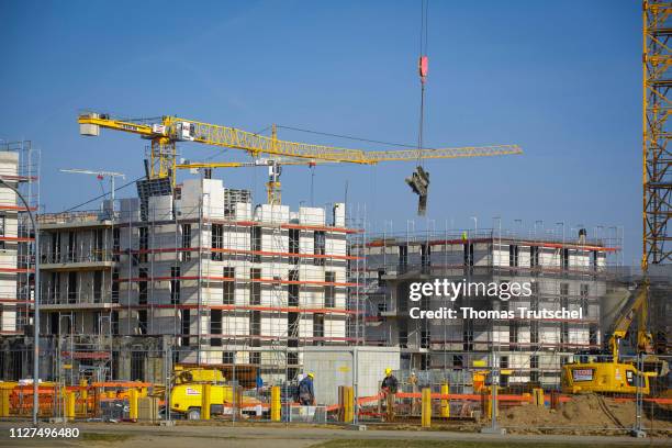 Berlin, Germany Symbolic photo on the subject of housing construction. Rough buildings of residential houses stand on a construction site in Berlin...