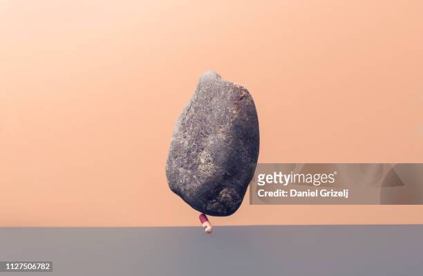 medicin pill under the weight of a stone - västra götaland county stock pictures, royalty-free photos & images