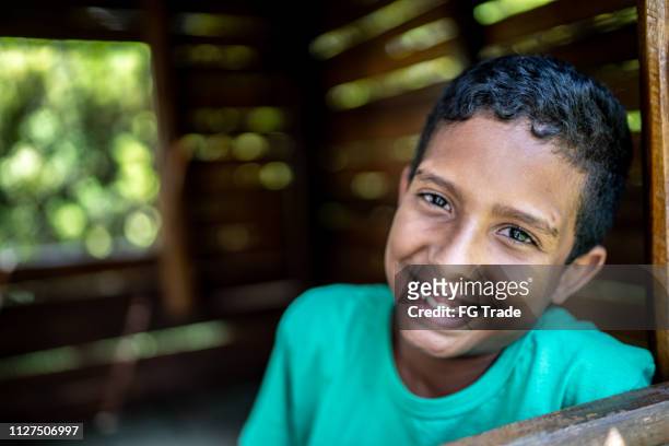 afro latino child at playground wooden house - south american culture stock pictures, royalty-free photos & images