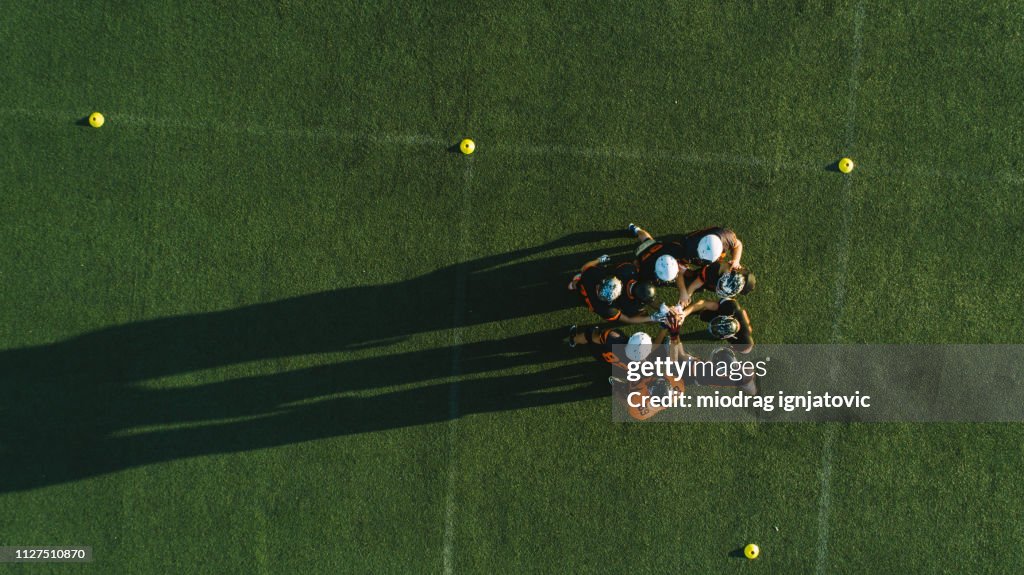 Drone point view of players huddling