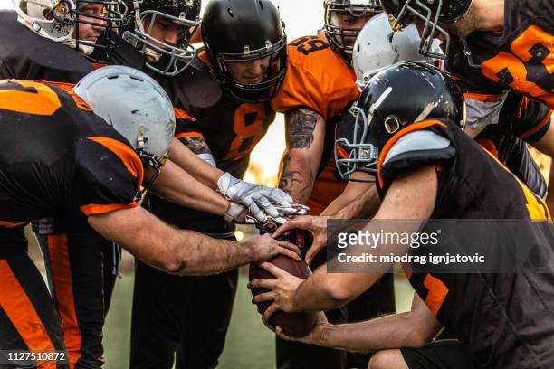 football team starting match - american football sport stock pictures, royalty-free photos & images