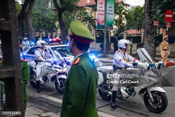 Vietnamese police motorcycle outriders wait as North Korean leader Kim Jong-un visits the DPRK embassy on February 26, 2019 in Hanoi, Vietnam. North...