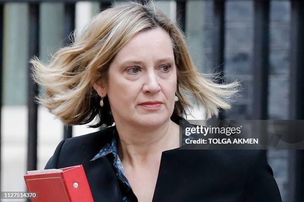 Britain's Work and Pensions Secretary Amber Rudd leaves after attending the weekly cabinet meeting at 10 Downing Street in London on February 26,...