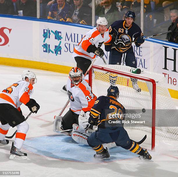Jason Pominville of the Buffalo Sabres scores Buffalo's first goal against Brian Boucher of the Philadelphia Flyers in Game Four of the Eastern...