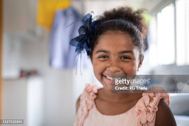 afro latino girl child portrait at laundry - pardo brazilian stock pictures, royalty-free photos & images