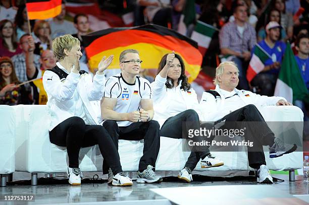 German team members Karen Heinrichs, Fabian Hammbuechen, Christine Neubauer and Uwe Ochsenknecht watch a game and celebrate a won point during the...