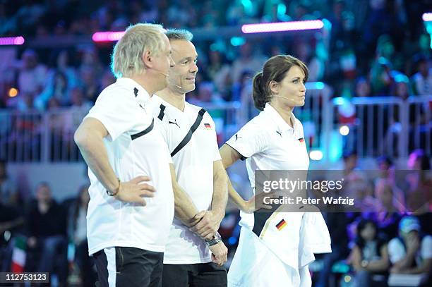 Uwe Ochsenknecht, Hannes Jaenicke and Anja Kling watch the boccia game during the 'Deutschland Gegen Italien' TV Show on April 20, 2011 in...