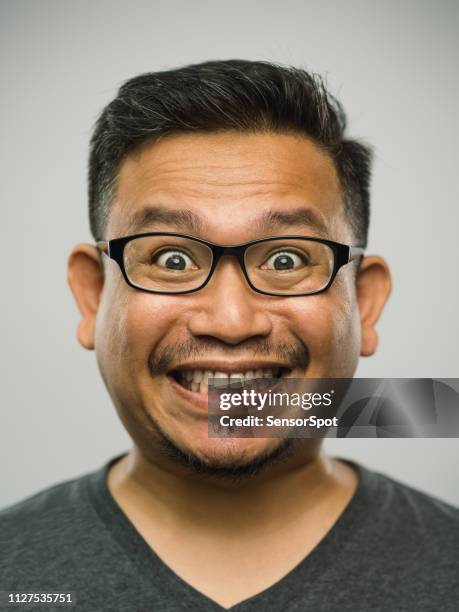 real malaysian adult man with very excited expression - portrait awe stock pictures, royalty-free photos & images